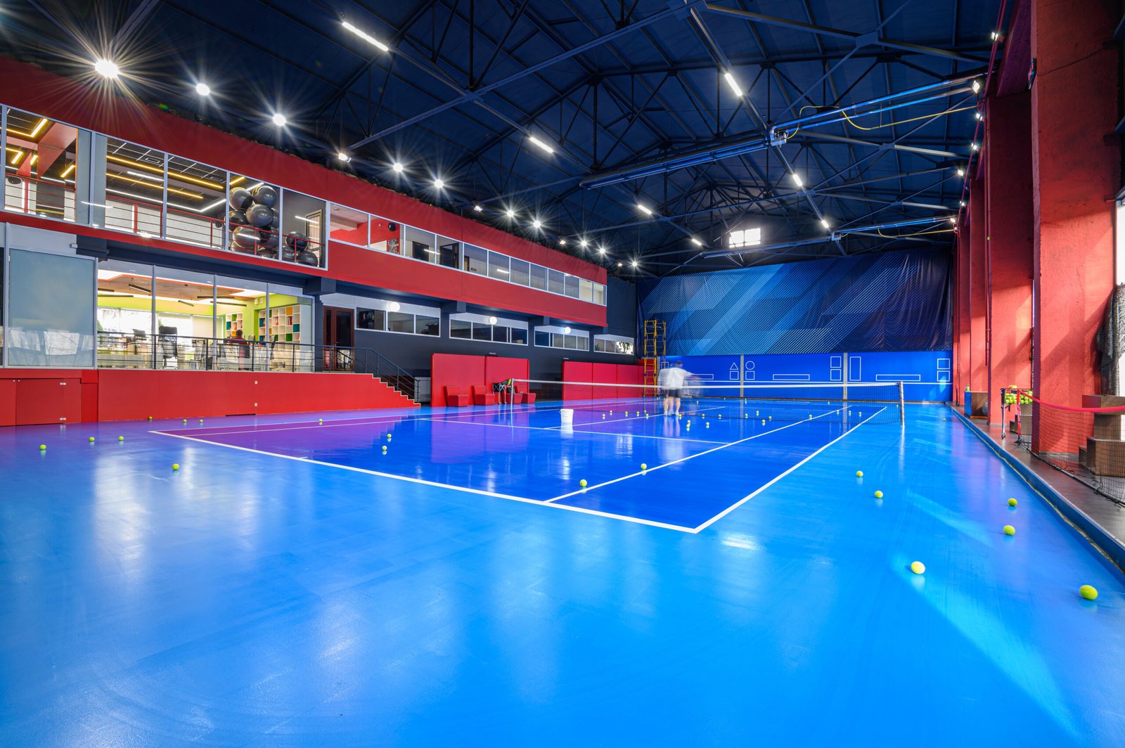 blue-colored-empty-indoor-tennis-court-2024-10-18-06-39-09-utc