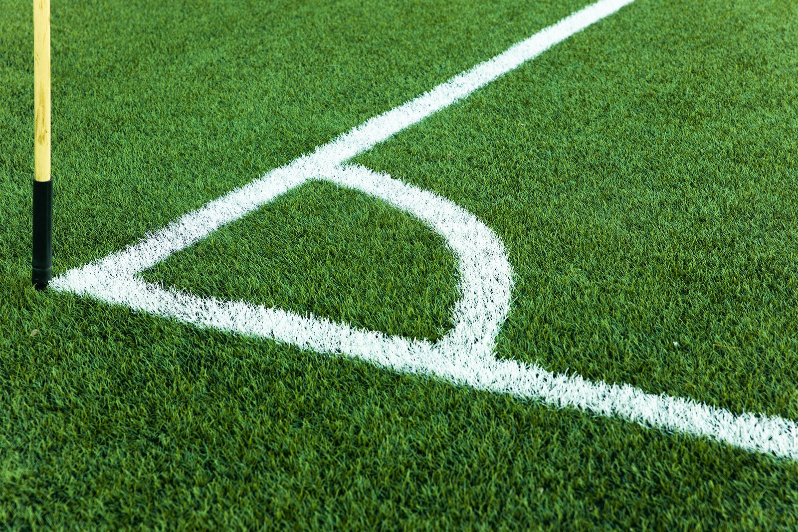 football-field-corner-with-white-marks-and-flag-2023-11-27-05-18-49-utc